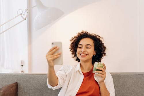 Woman Taking Selfie While Drinking A Fresh Smoothie