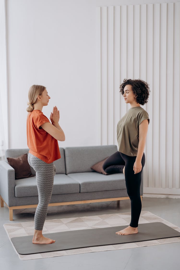 Two Women Doing Yoga Exercise