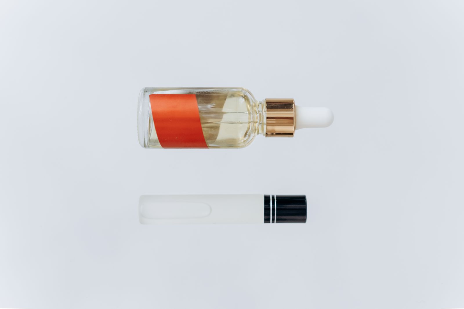 Minimalist oil skincare bottle on a clean surface without people