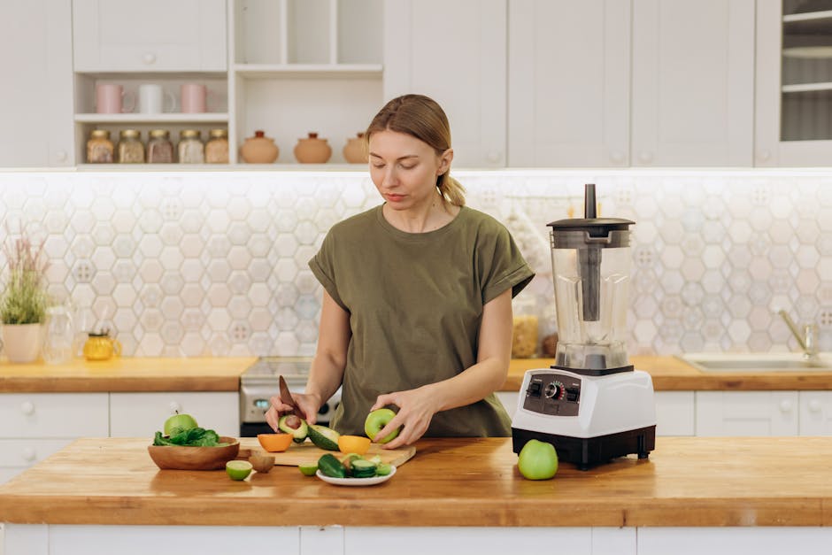 Ninja vs NutriBullet: Smoothie Texture Showdown Woman prepares a healthy meal with fresh ingredients in a modern kitchen.