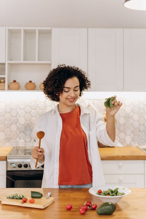 Woman Making A Green Vegetable Salad