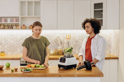 Woman Preparing A Smoothie With Fresh Fruits