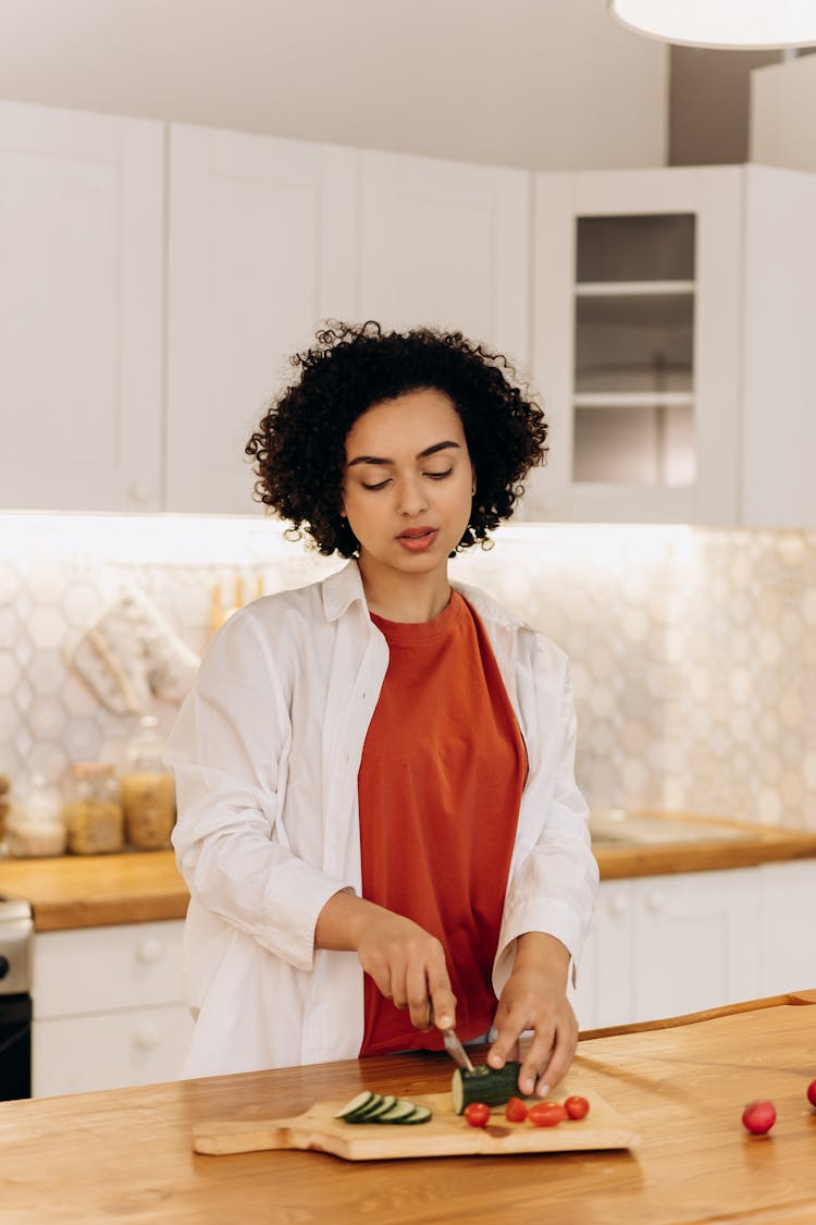 Woman Slicing Cucumber