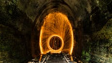 Person Welding an Underground Railway Tunnel