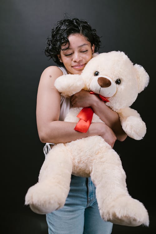 Free Woman Hugging White Bear Plush Toy Stock Photo