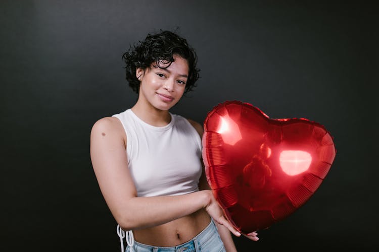 Woman In White Tank Top Holding Heart Balloon