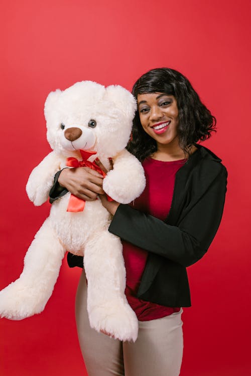 Woman Holding a Teddy Bear Stuffed Toy