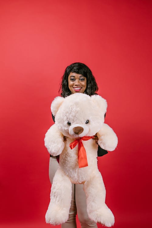 Free Woman Holding a Teddy Bear Stuffed Toy Stock Photo