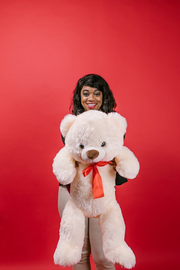 Woman Holding A Teddy Bear Stuffed Toy