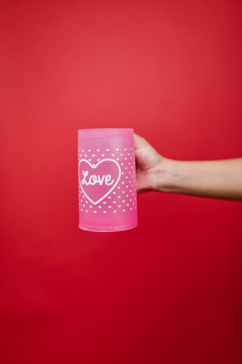 Person Holding Pink Mug