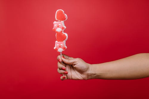 Person Holding a Lollipop