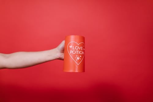 Person Holding Red Mug