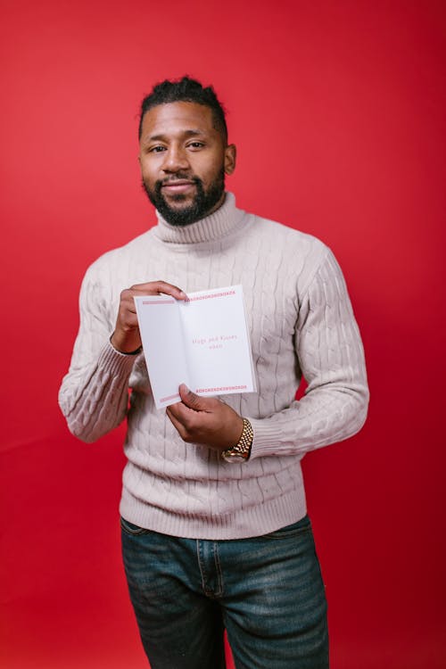 Man in White Long Sleeve Shirt Holding Valentine's Day Card