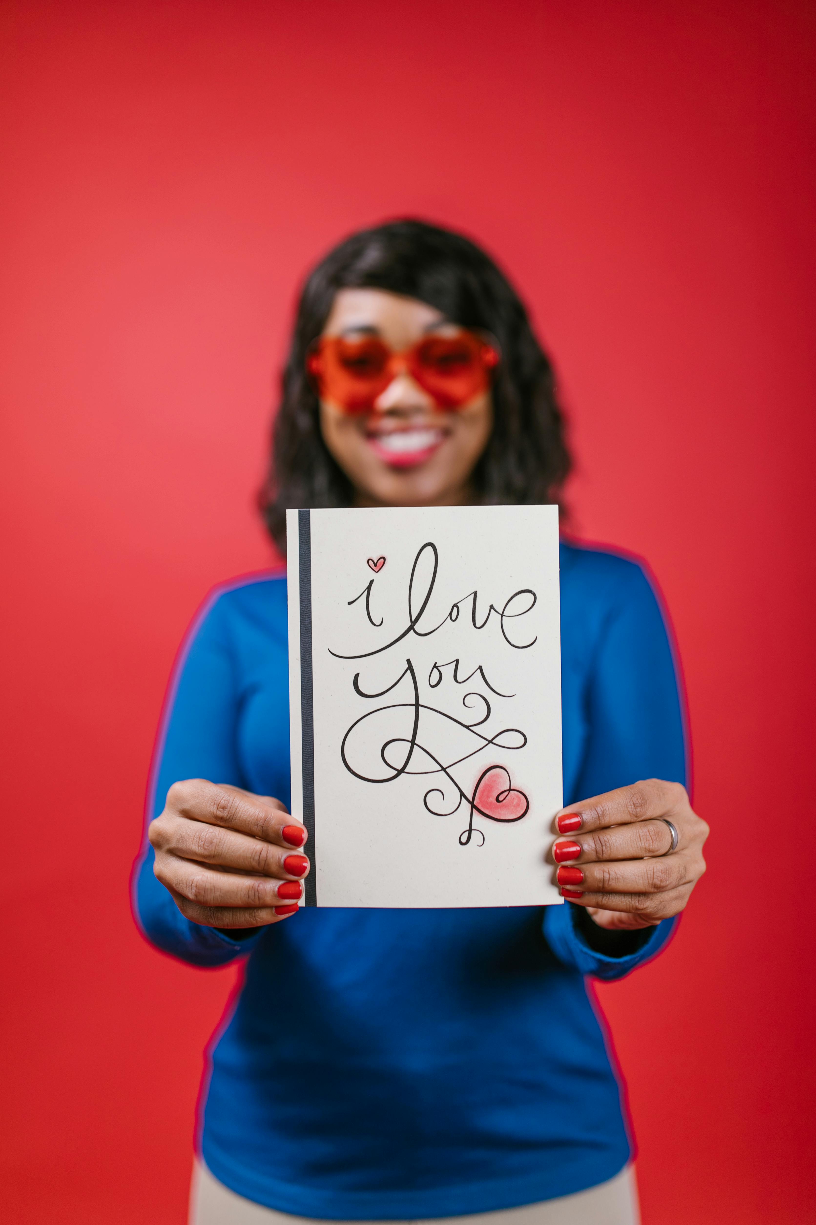 woman holding a valentines card