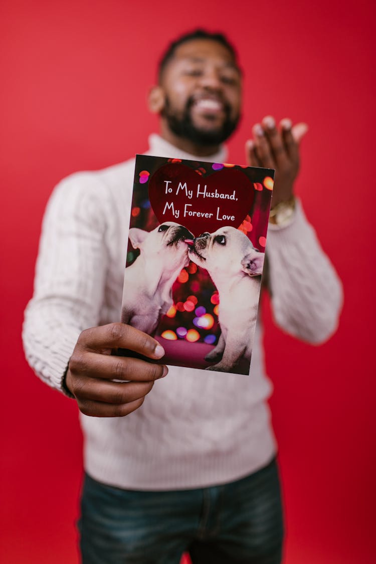 Man Holding A Valentines Card