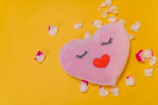 Heart Shaped Pillow on Yellow Background