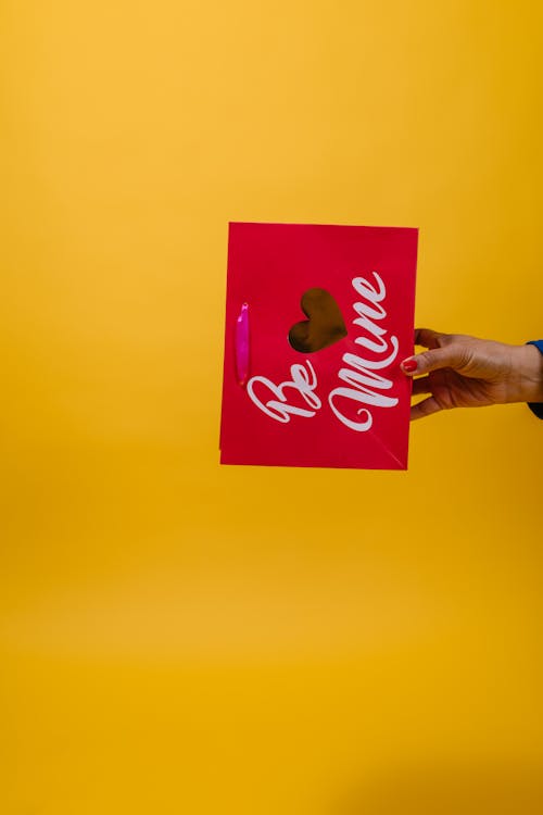 Person Holding Be Mine Paper Bag