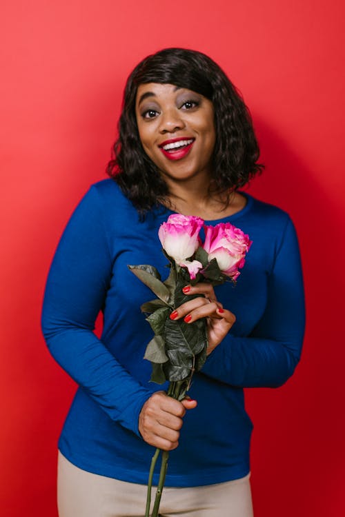 Woman Holding Two White Roses