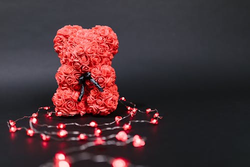 Free Red Teddy Bear Shaped Valentine's Gift on Black Background Stock Photo