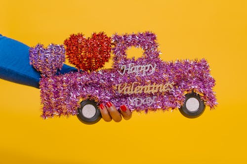 Person Holding Car Shaped Valentine's Gift