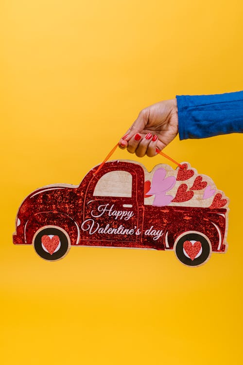 Free Person Holding Car Shaped Valentine's Gift Stock Photo