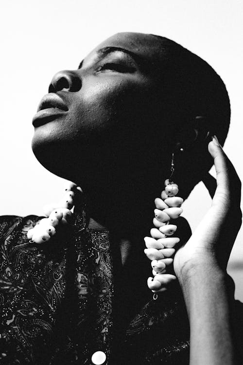 Grayscale Photo of Woman Wearing Earrings