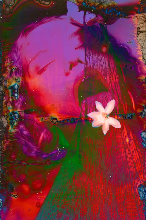 Sensual abstract female with multicoloured hair opened mouth and closed eyes holding and licking net decorated with white flower