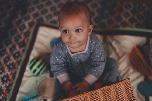 Shallow Focus of Cute Baby Looking at Camera