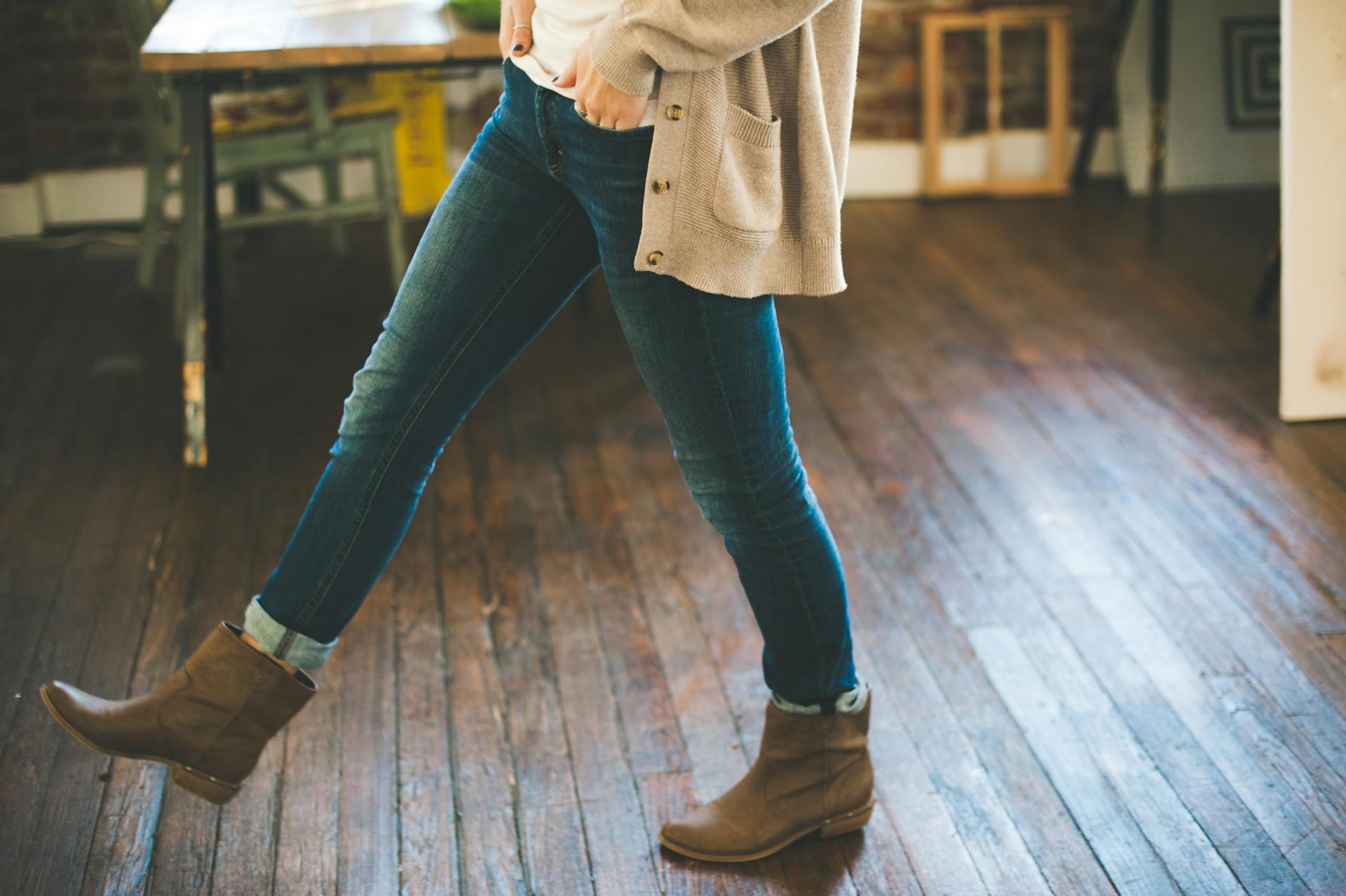 Woman Walking on Brown Parquet Floor