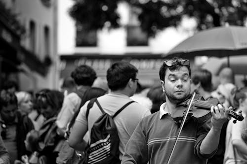 A Man Playing Violin on the Street