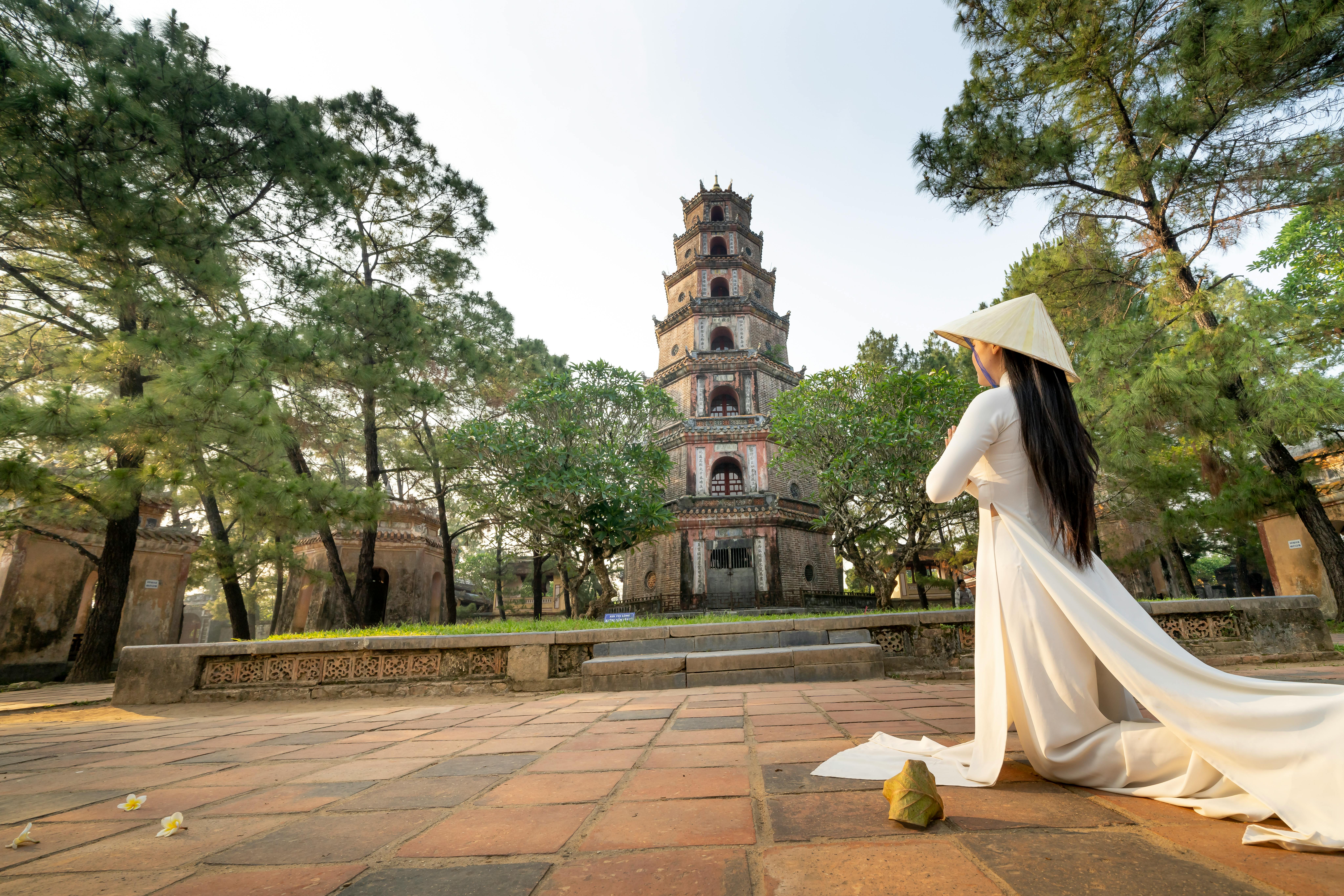 Free Anonymous woman praying near old temple in Vietnam Stock Photo