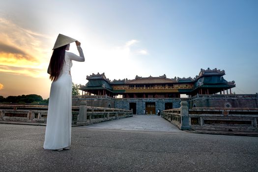 Anonymous woman against meridian gate in Vietnam