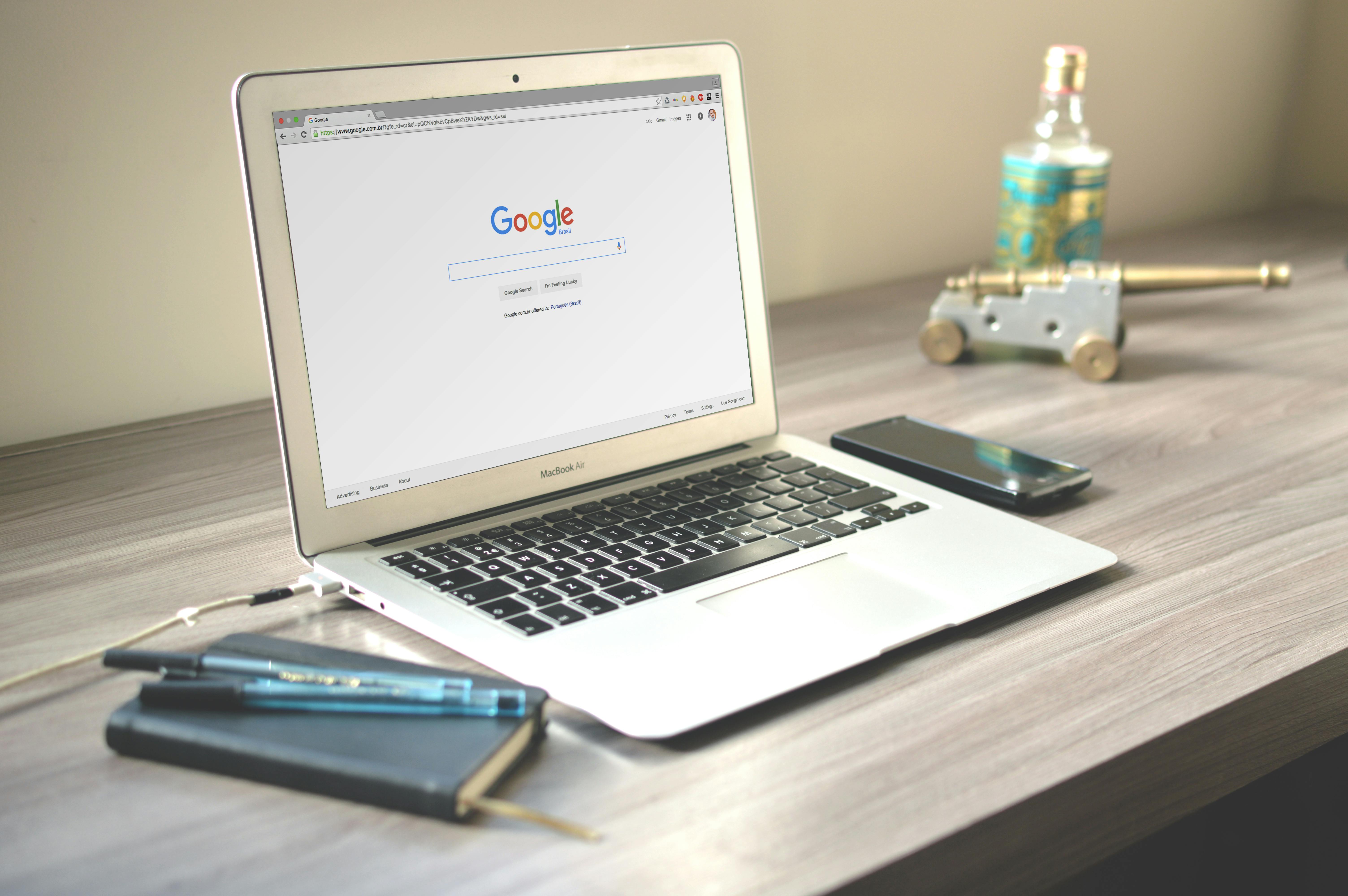 Macbook Air on Grey Wooden Table · Free Stock Photo