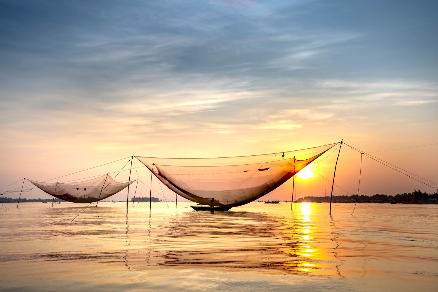 Chinese fishing nets on the Fort Kochi waterfront at dusk