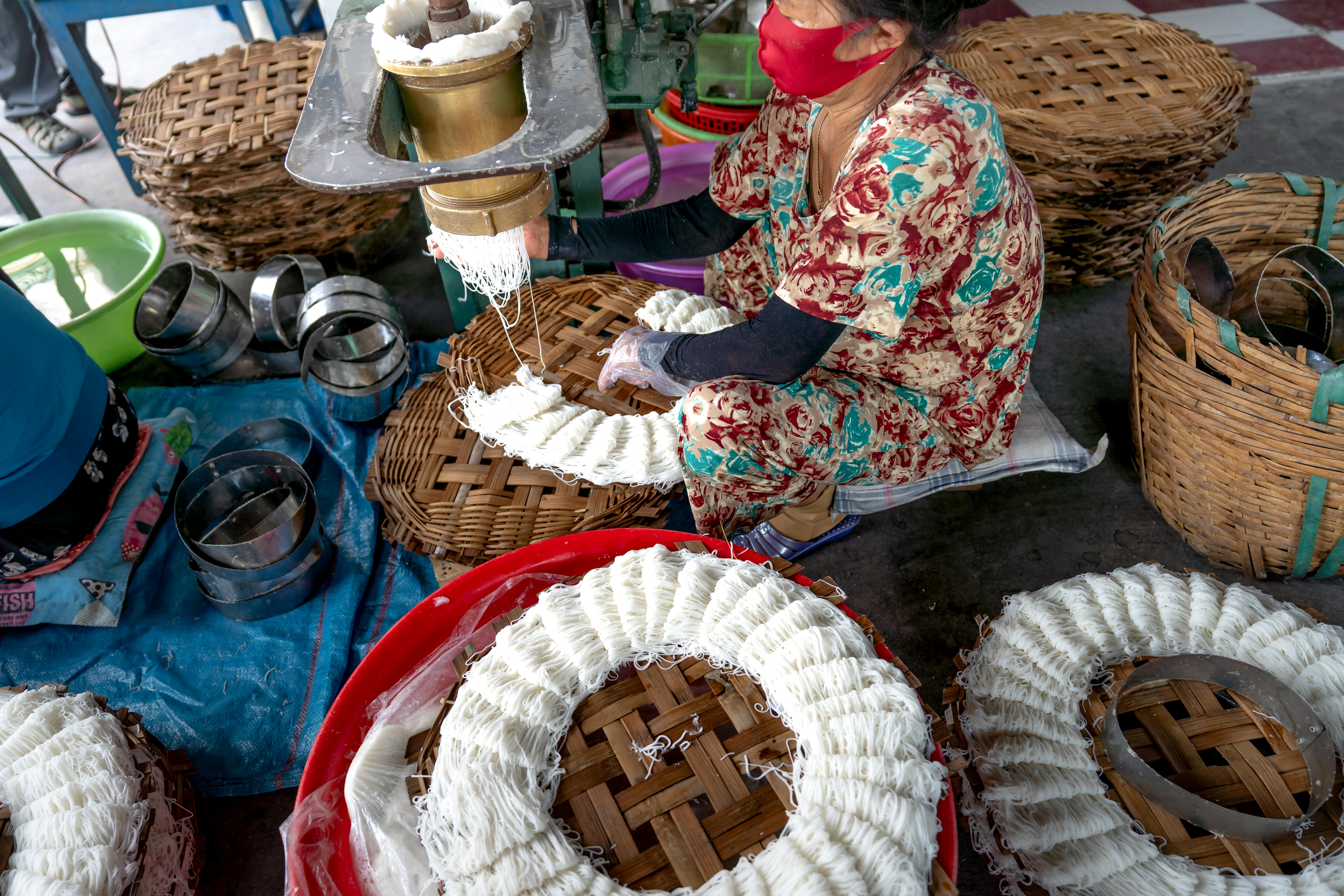 a woman making street food