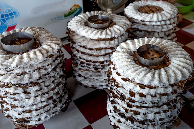 Noodles On Wicker Caps On Floor In Factory