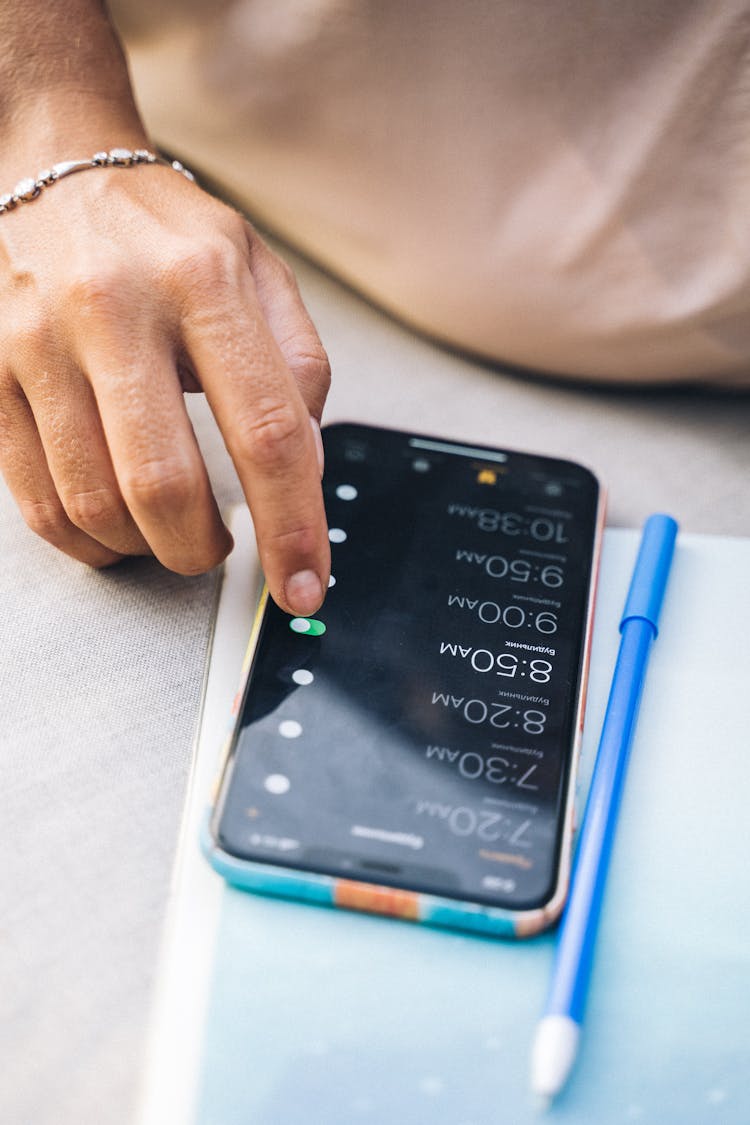 Close-Up Shot Of A Person Touching A Cellphone