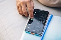 Close-Up Shot of a Person Touching a Cellphone