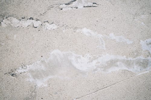 Rough concrete texture background with crack