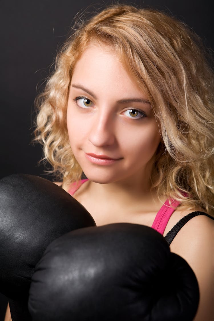 Woman Wearing A Black Boxing Gloves