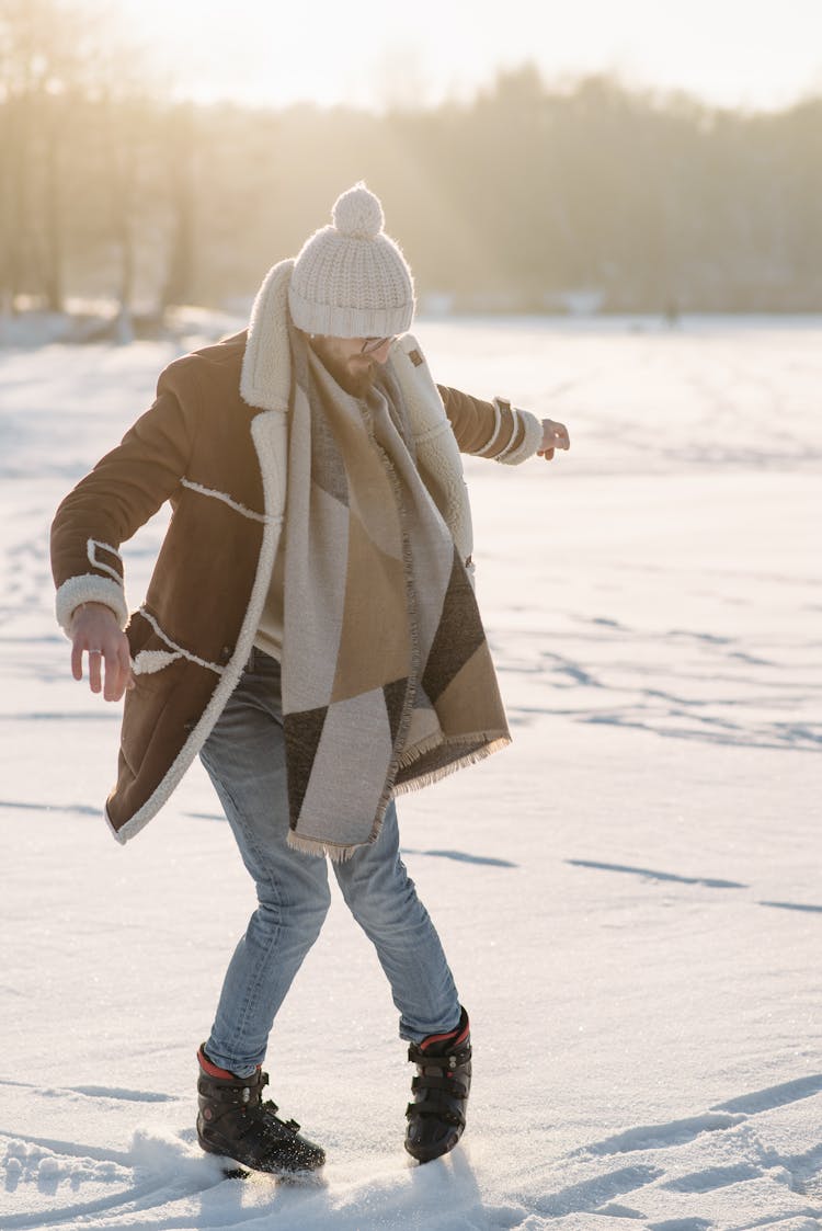 Man In Brown Fleece Jacket Ice Skating