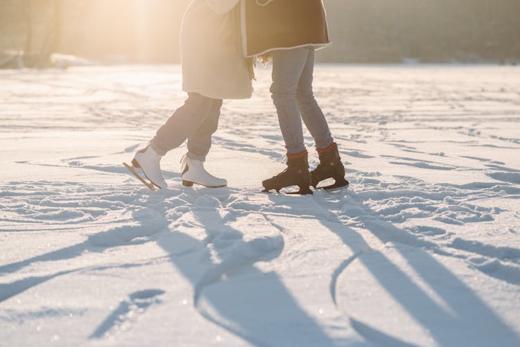 People Standing Wearing Ice Skating Shoes