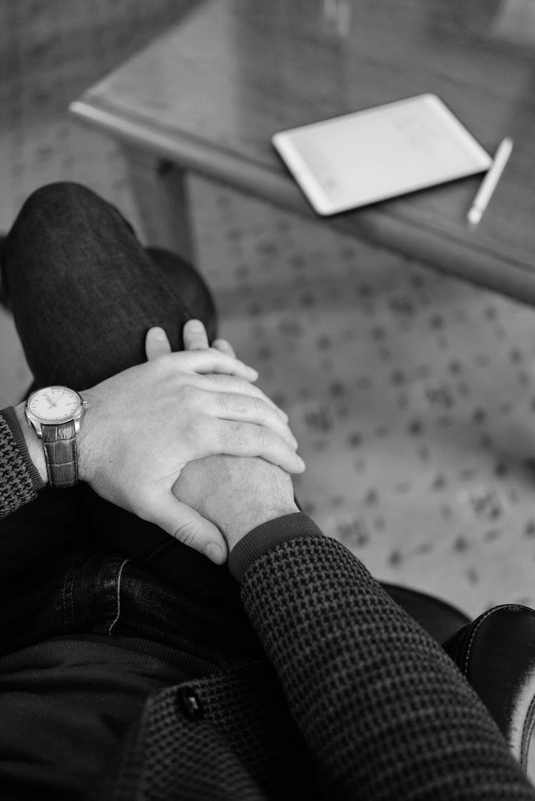 Grayscale Photo Of A Person Wearing Round Silver Analog Watch