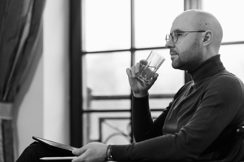 Person drinking a glass of water, photo by Pavel Danilyuk on Pexels