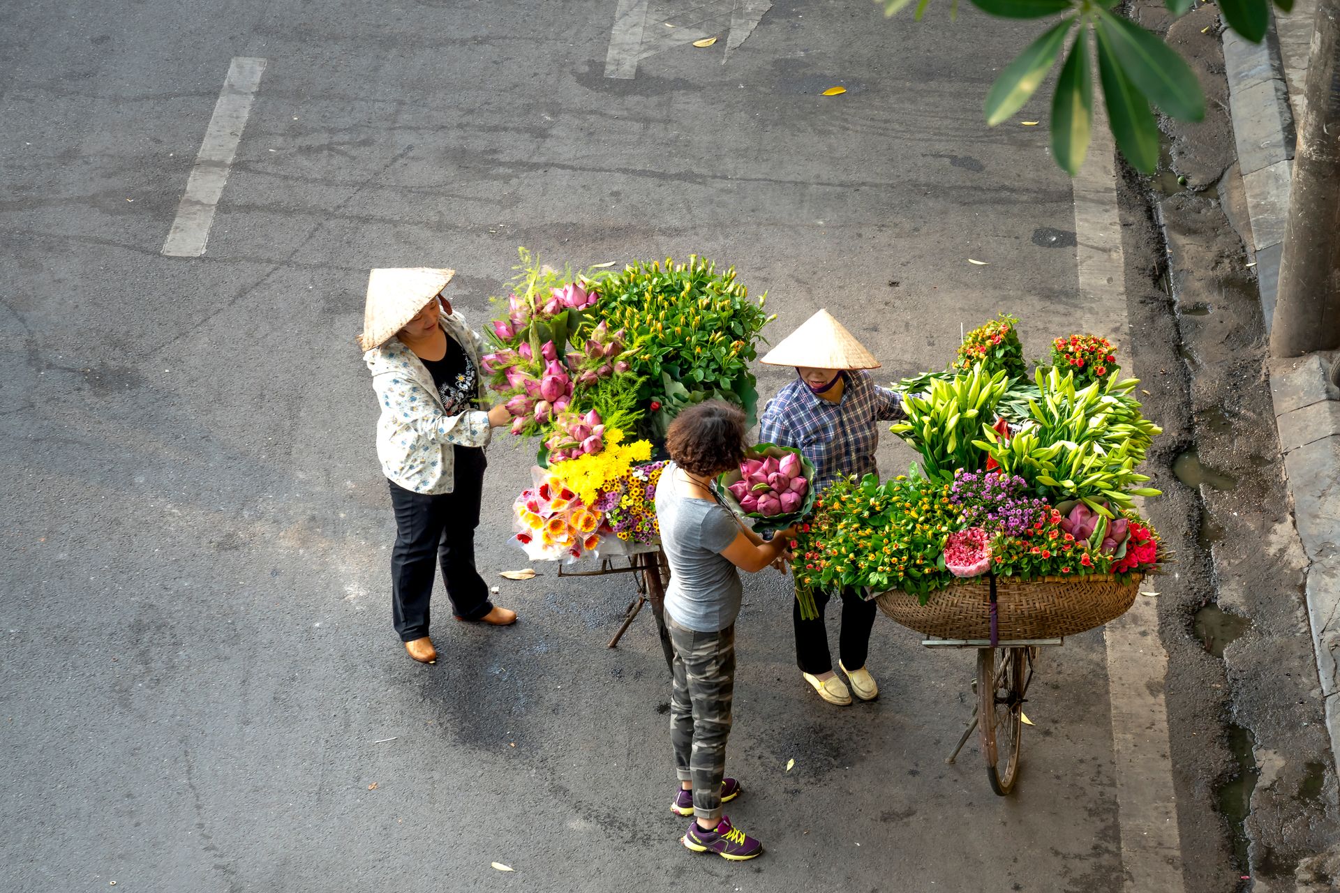 A Person Buying a Bouquet of Flowers from Street Vendors