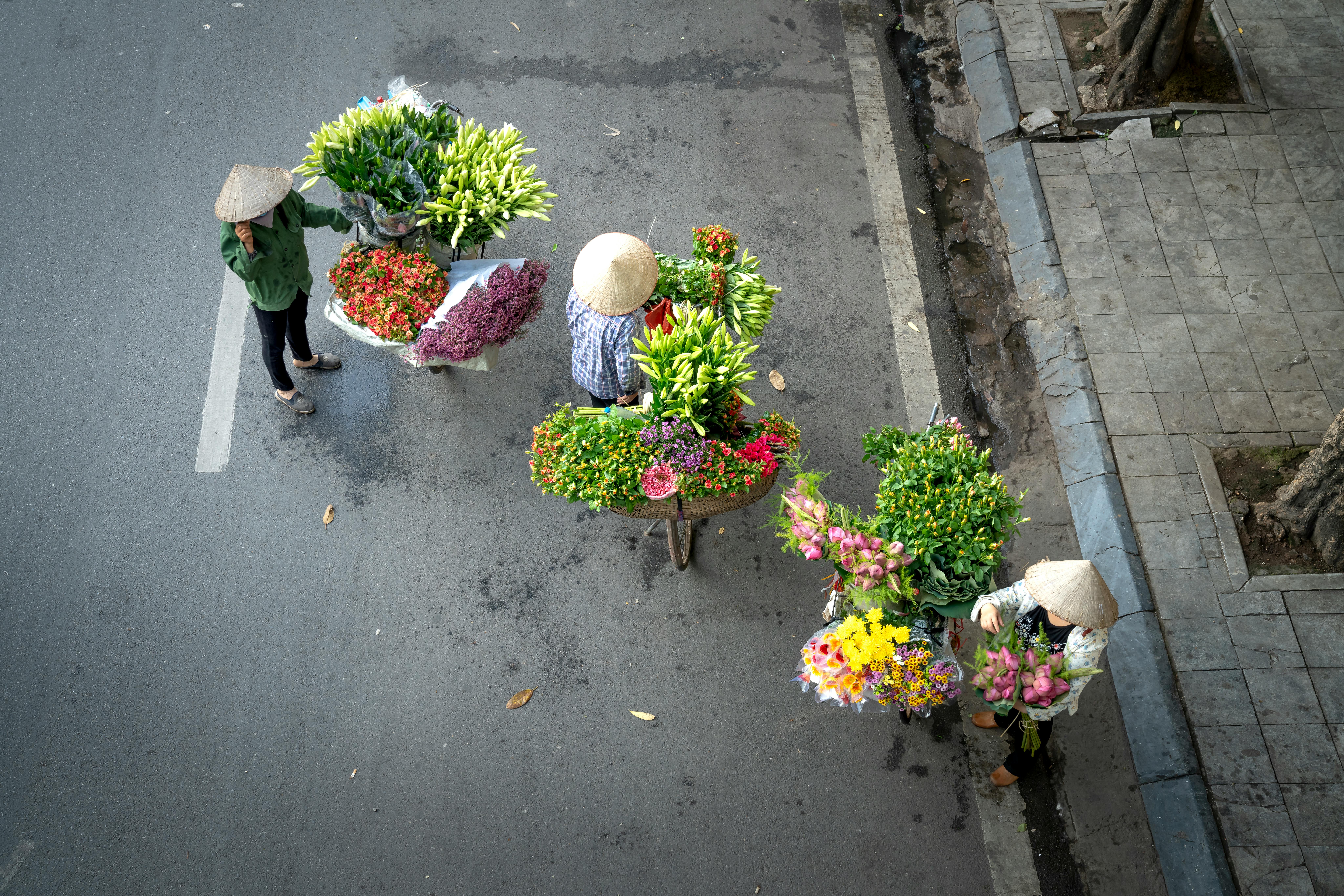 People Selling Bouquet of Flowers on the Street · Free Stock Photo