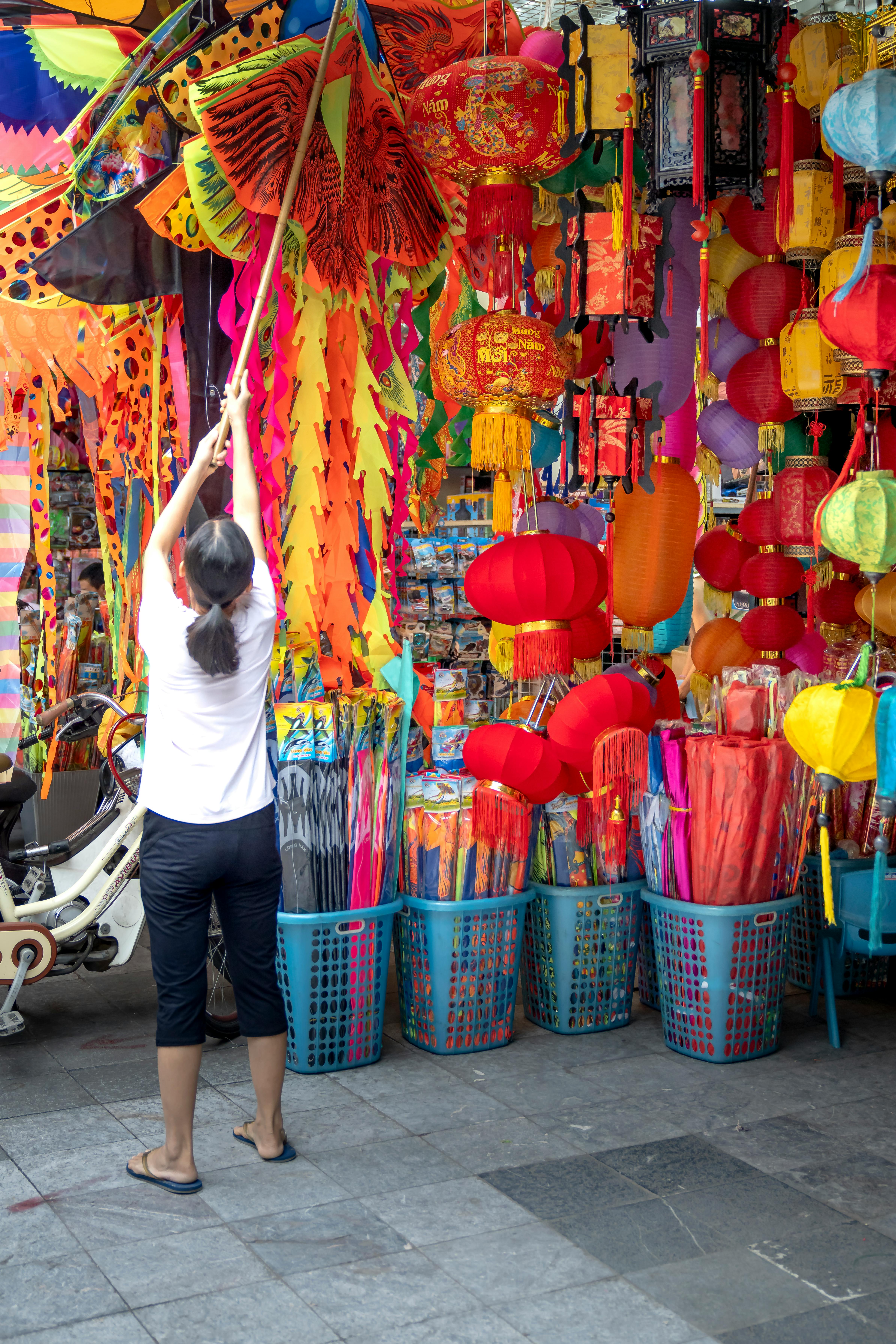 colorful traditional lanterns and fans on market