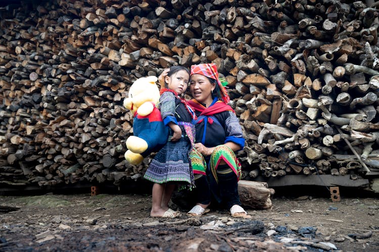 Native Mother And Her Daughter With A Teddy Bear 