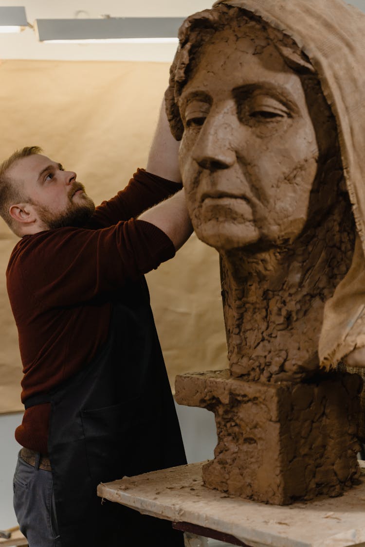 A Sculptor Working 