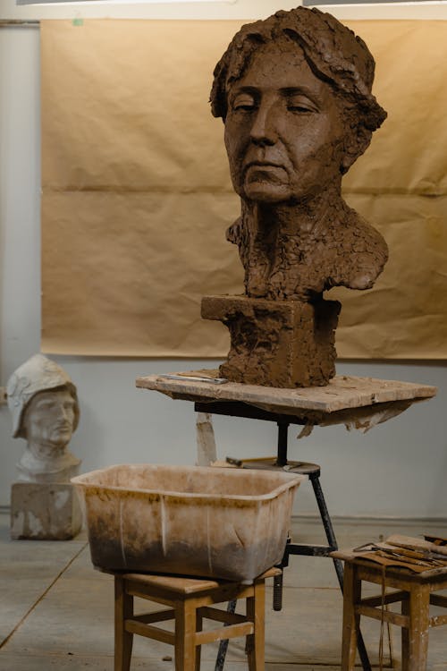 Brown Concrete Man's Head Sculpture